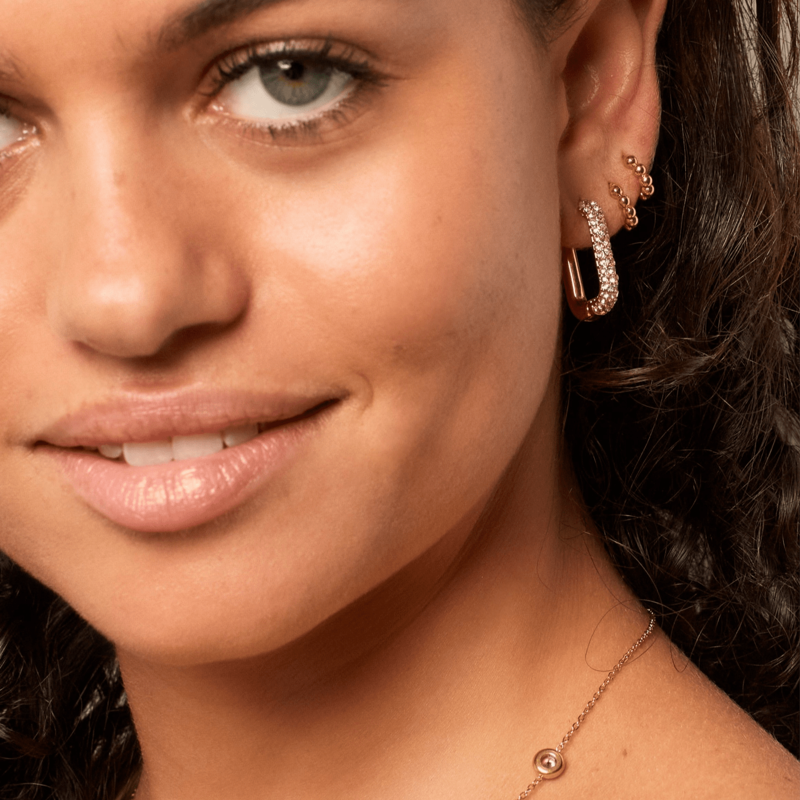 Gold rectangular hoop earrings with sparkle