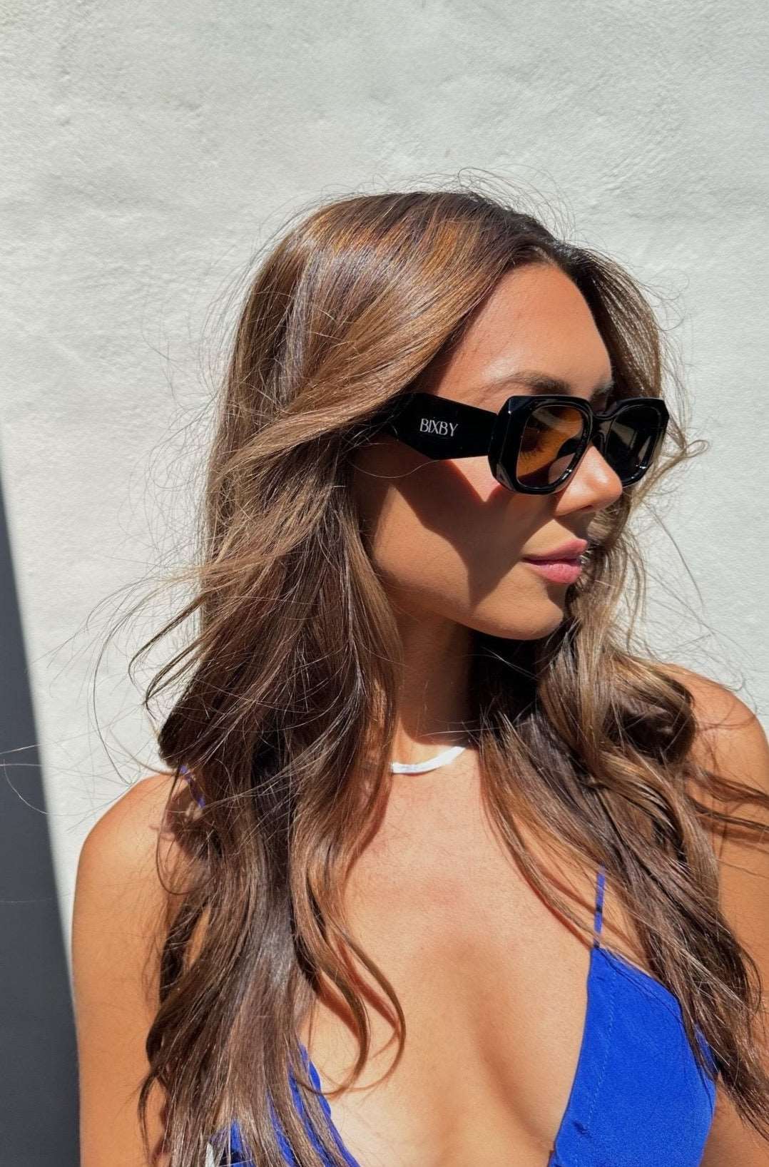 Model wearing our Bixby black sunglasses