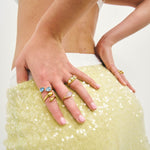 Billie rings in many coloured gemstones on models hands