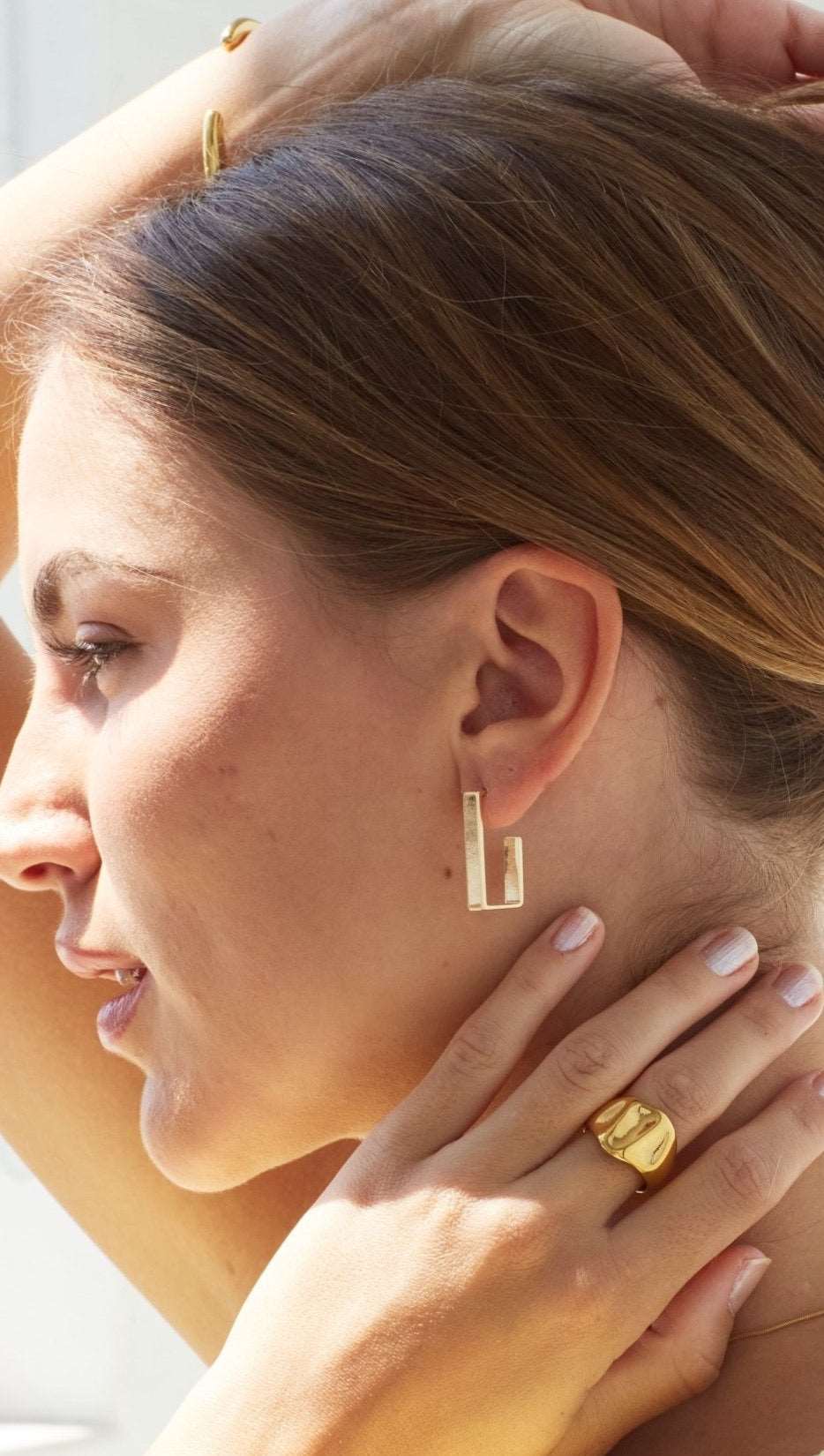 Model wearing 18k gold fill Bixby jewellery 