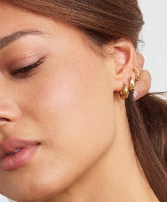 Model in Bixby and Co earring stack 