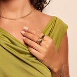 Model in coloured oval gemstone rings from Bixby and Co 