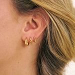 Grip Huggies in an it girl earring stack 